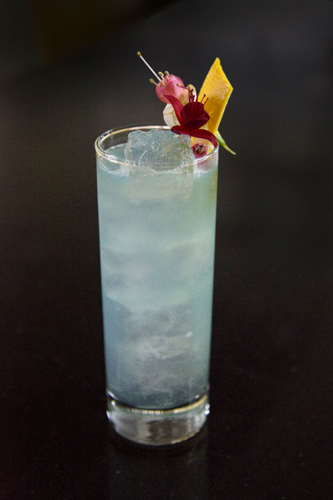 Indigo colored cocktail with Bols Genever, Bols Blue Curacao, Bols Lychee, fresh lime and ginger beer