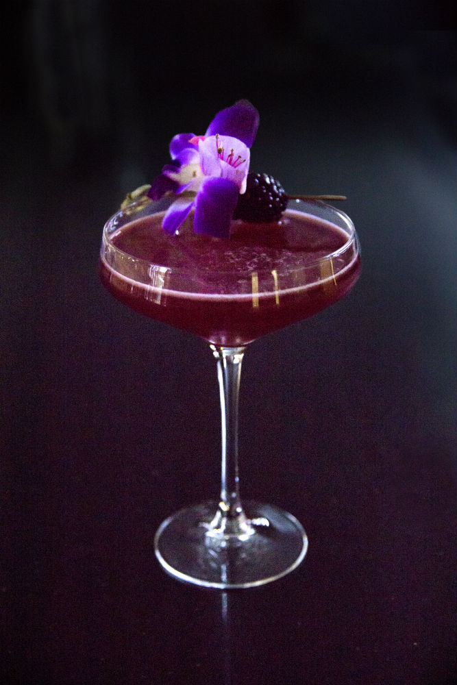 Violet colored cocktail with Tequila, Bols Cassis, and brut Cava