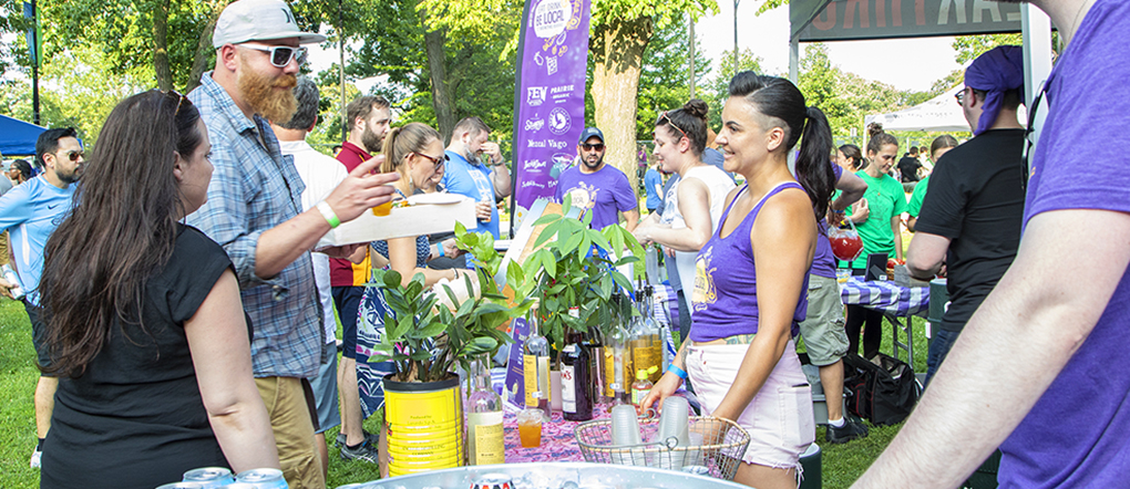 Bartenders mingling with guests at the Breakthru Beverage tent at Green City Market Chef BBQ