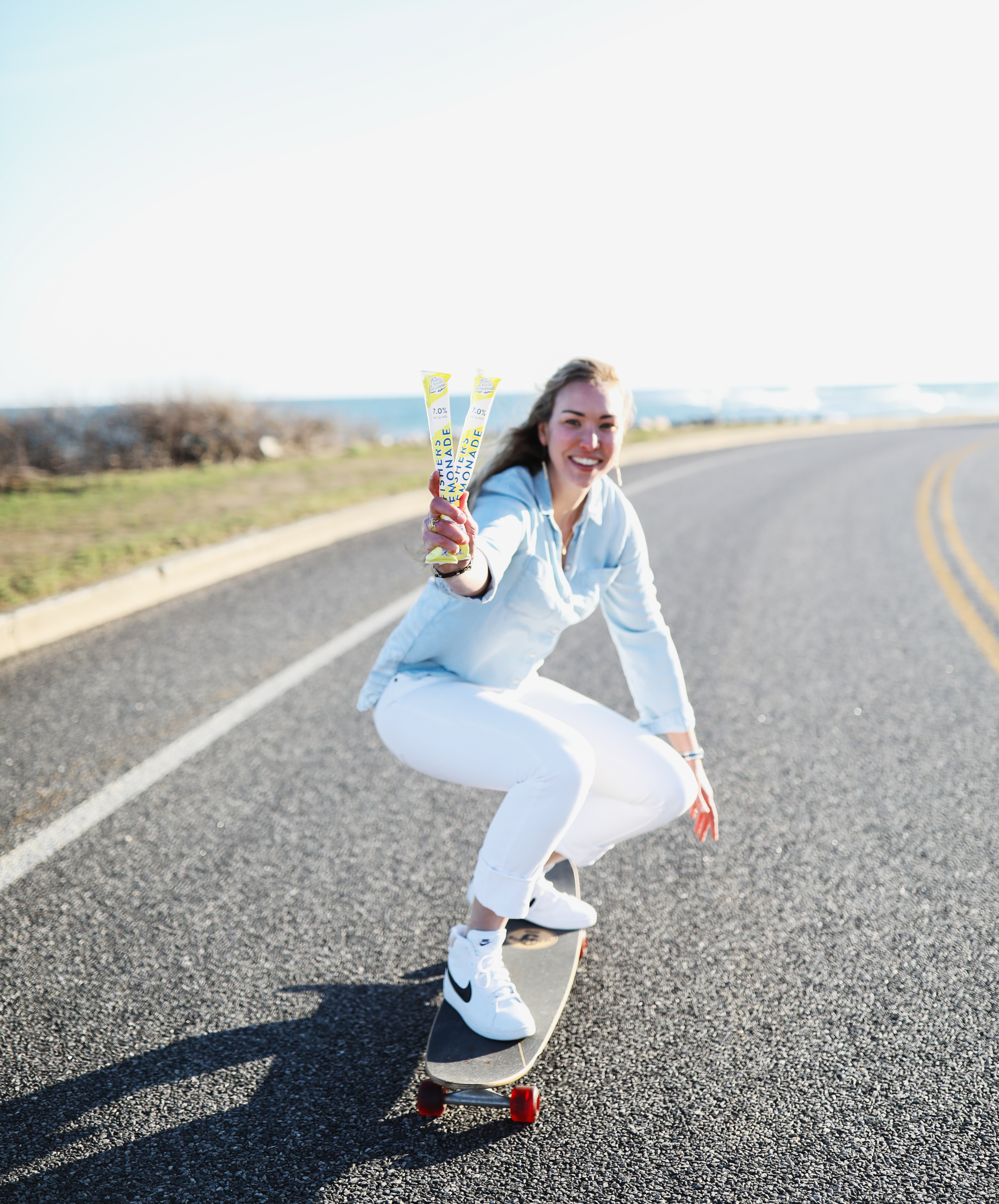 Fishers Island Lemonade founder Bronya Shillo skateboarding along the coast