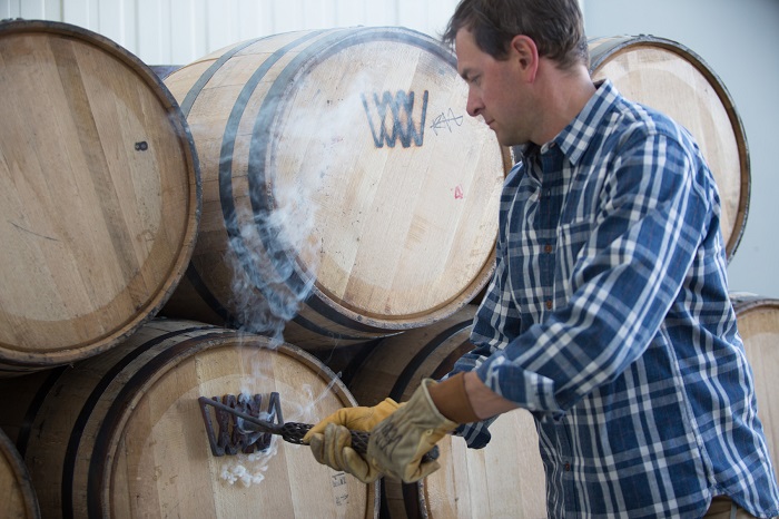 David DeFazio branding a barrel