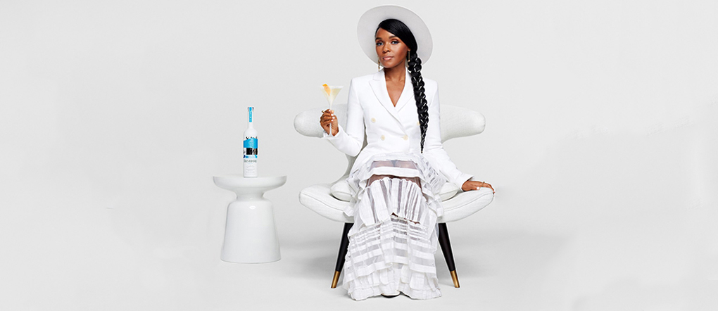 Janelle Monae seated next to Belvedere bottle